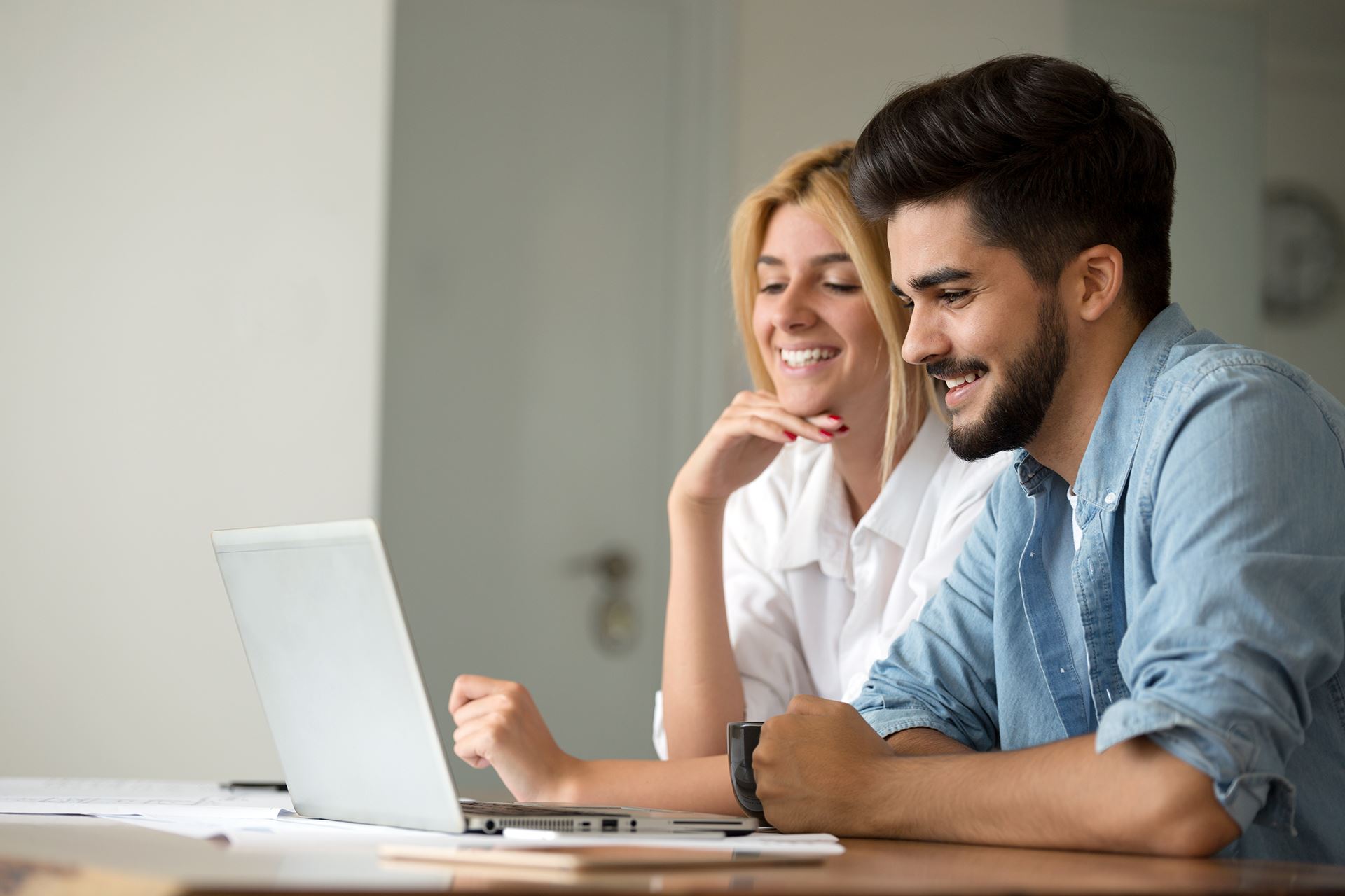Man and woman on laptop computer