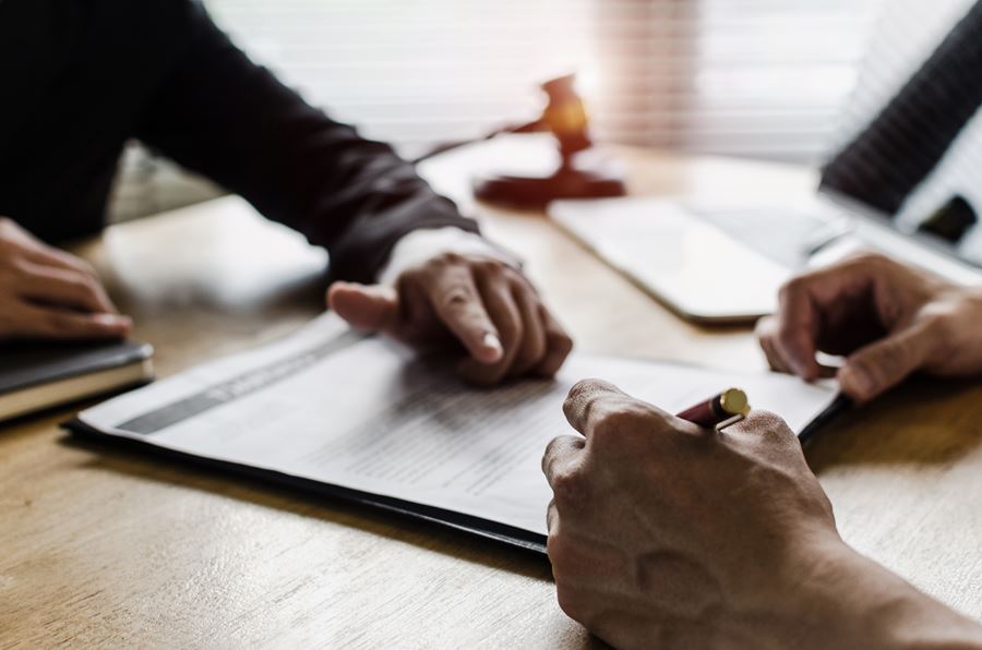 Client going over paperwork with employee