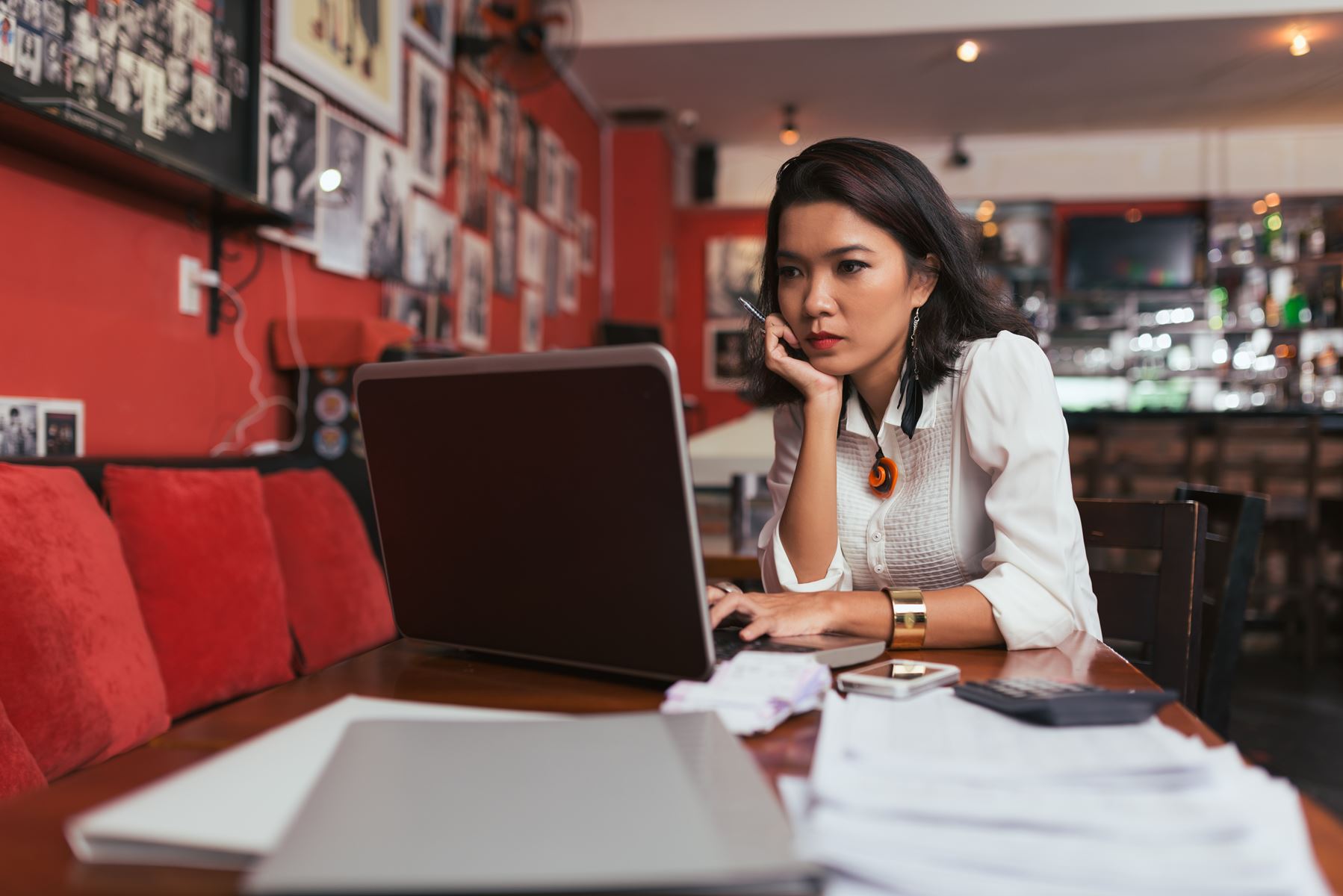 Woman Using Computer at her business